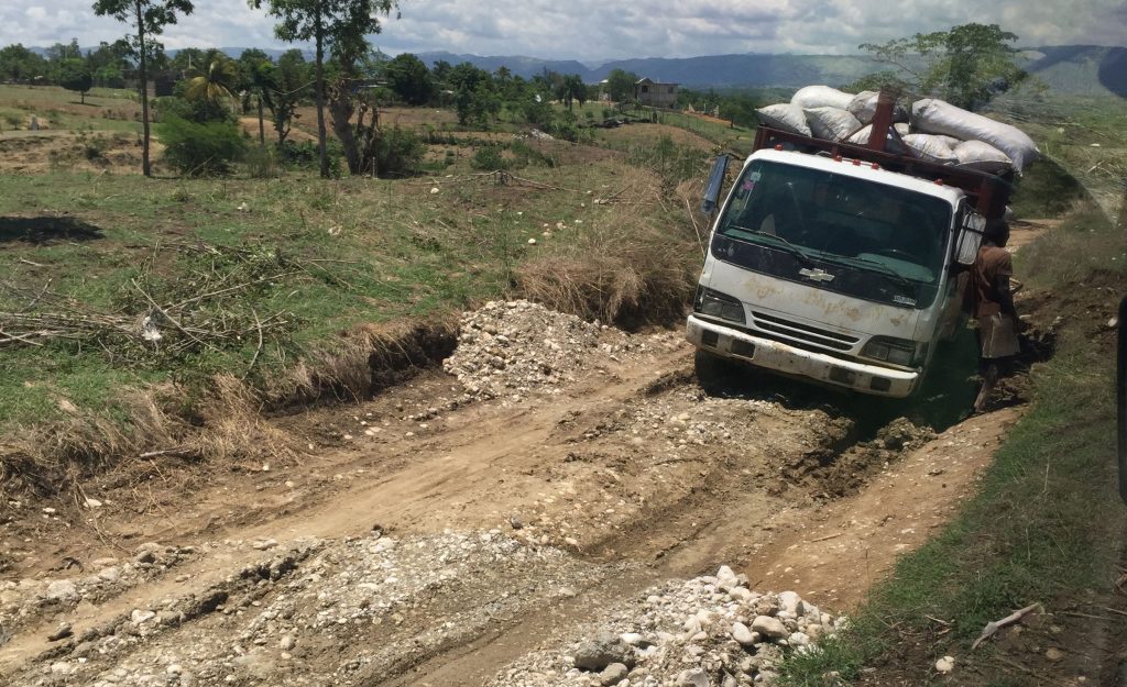 World Vision Haiti Video Production Trip - A truck stuck in the deep mud of a Haitian road