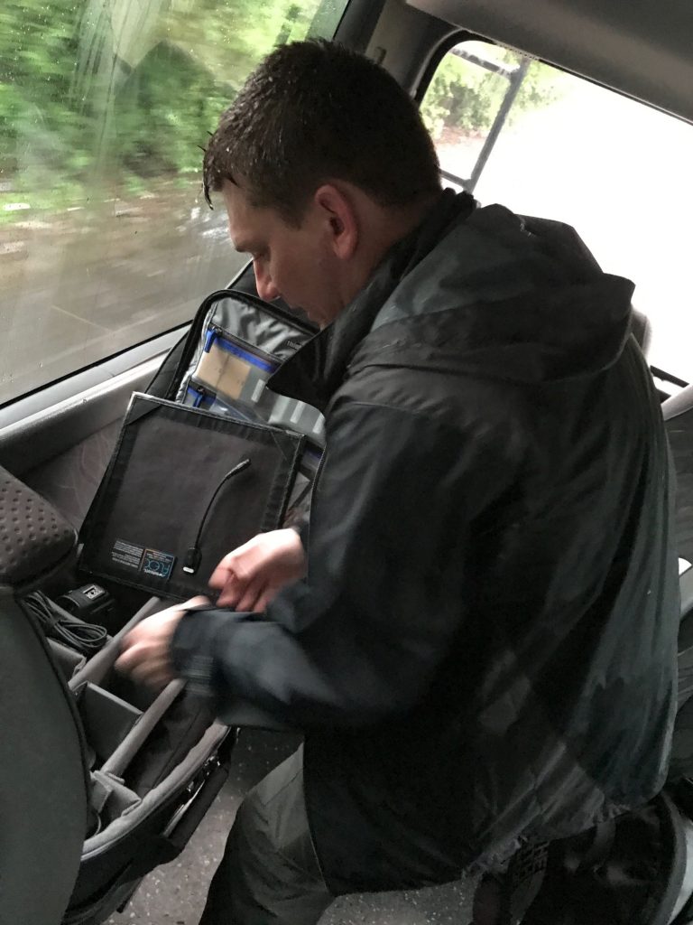 David packing video gear in the van on a trip to El Salvador with Compassion International